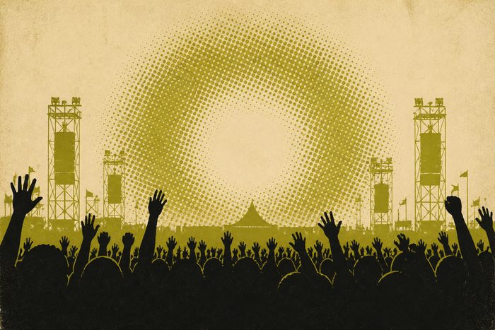 An original printed graphic made for this archive: the silhouette of a festival crowd of raised hands under a halftone stage light